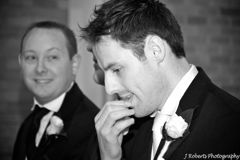 Groom nervously waiting in the church - wedding photography sydney